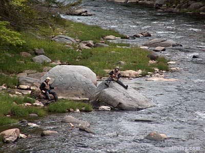 Vermont fisherman fishing for trout and salmon during Spring. 